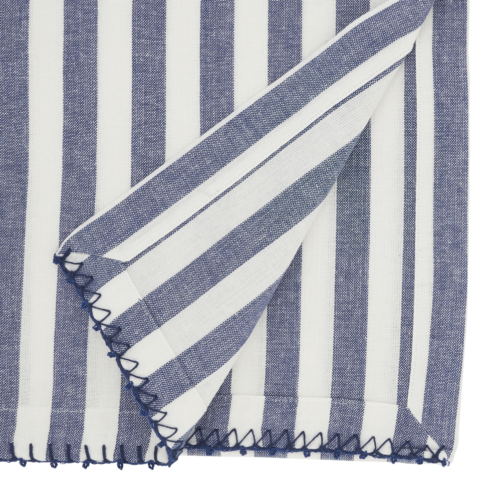 Blue and white striped fabric with a folded edge on a white background