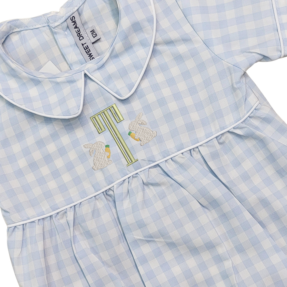 Blue checkered dress with embroidered design on a white background