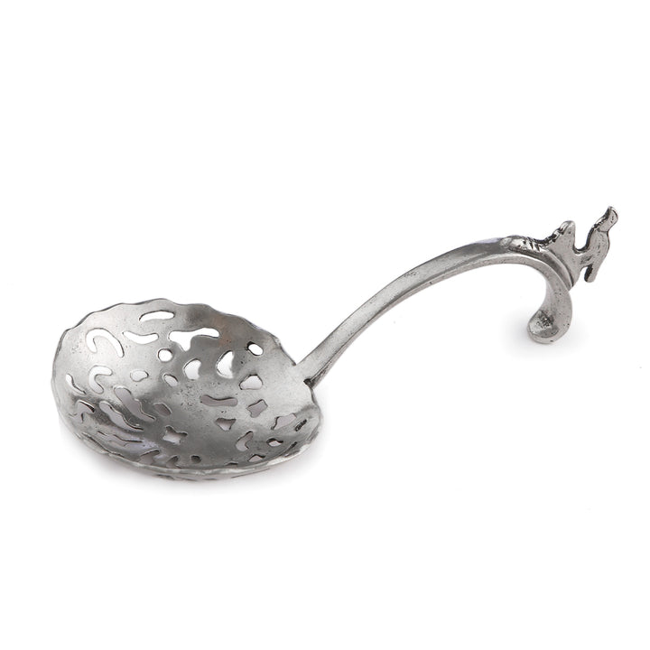Decorative silver spoon with a detailed handle on a white background