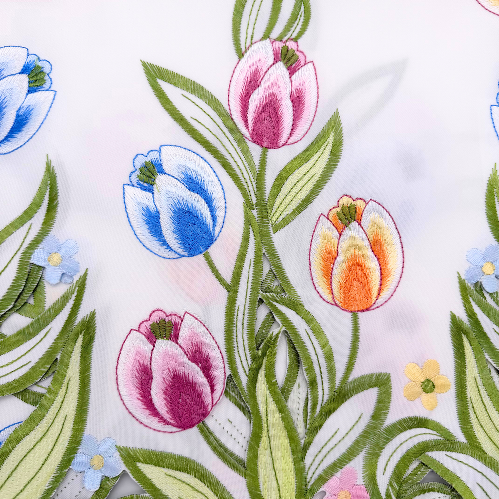 Embroidered floral design with tulips on a white background