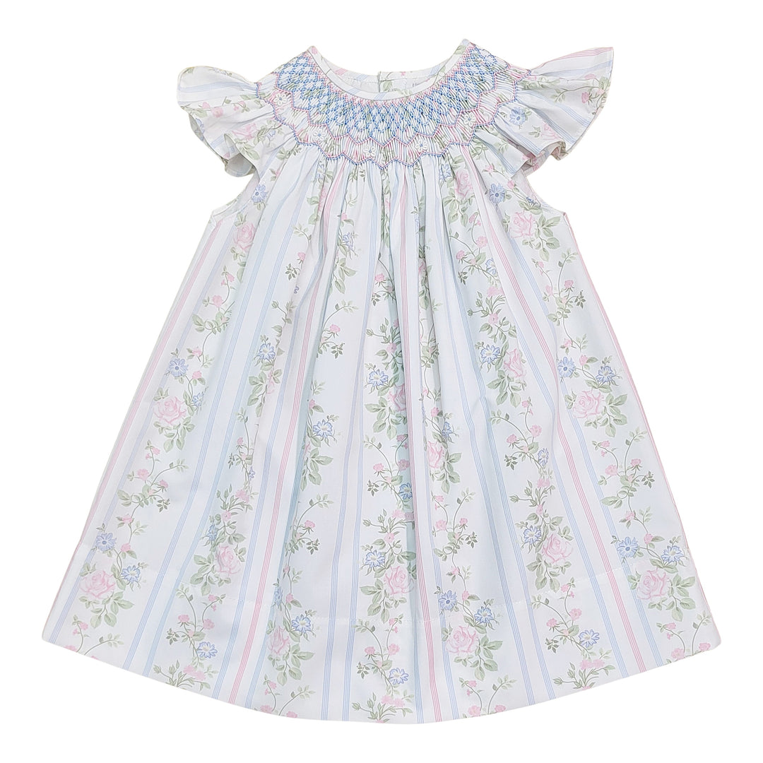 Floral dress with smocked bodice on a white background