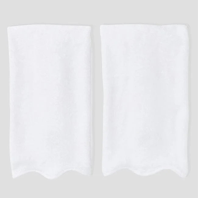 Two white rectangular fabric pieces with scalloped edges, shown side by side on a light gray background.