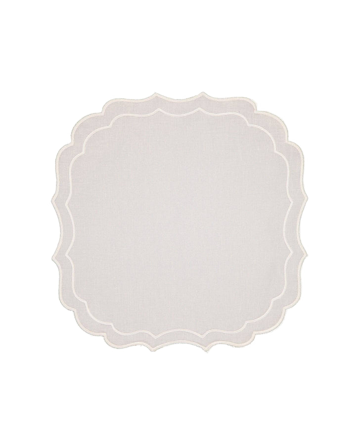 white linen placemat with scalloped border