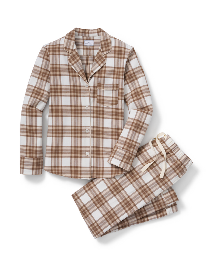 A two-piece pajama set featuring a long-sleeve button-front shirt and matching shorts, both in a brown and cream plaid pattern, displayed on a clean white background.