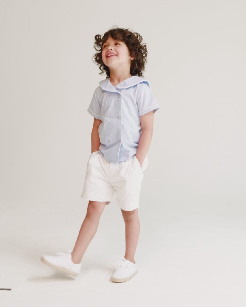 Boy wearing nautical inspired summer outfit